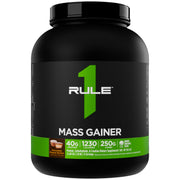 Rule 1 Mass Gainer tub front label highlighting 1,220+ calories per serving.