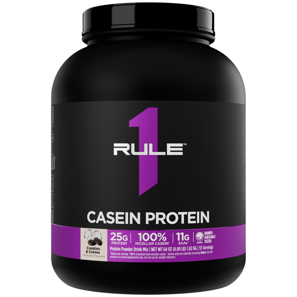 Rule 1 Proteins Casein scoop beside a glass for nighttime fueling