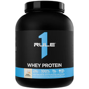 Rule 1 Whey Protein vanilla tub featuring a premium three-whey blend for nutrition.