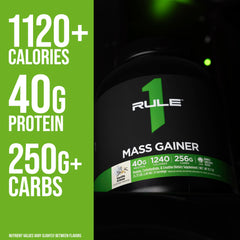 Rule1 Mass Gainer glass being stirred to create a thick, creamy shake.