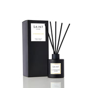 SAINT reed diffuser in matte black jar enhances home ambiance.