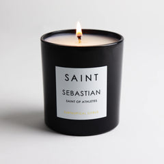 Close-up of Italian prayer coin embedded in the SAINT Sebastian candle for a meaningful keepsake.