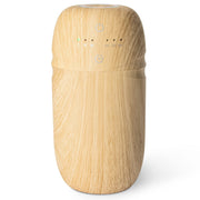 Salubrito waterless diffuser with wood-grain base enhances a warm ambiance.