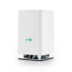 ScentAir Whisper Home compact diffuser shown on a shelf for discreet scenting