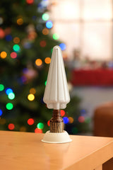 SCENTKEEPER Christmas Tree Diffuser on a coffee table delivers festive scent.