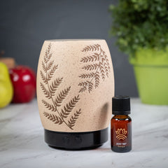 Scentsationals Eclectic Fern diffuser glowing softly for a relaxing evening atmosphere.