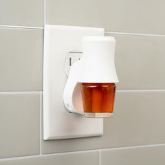 Scentsationals swivel plug diffuser shown in action with adjustable outlet compatibility.