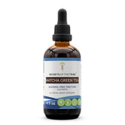 Secrets of the Tribe matcha tincture bottle on wood, easy absorption for daily use.
