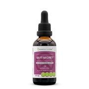 Secrets of the Tribe Quit Secret Alcohol-Free Extract bottle on a neutral backdrop.
