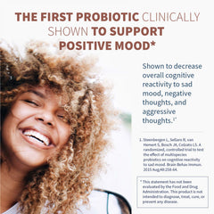 Close-up of Klaire Labs probiotic sachet showing a 9-strain blend for gut-brain support.