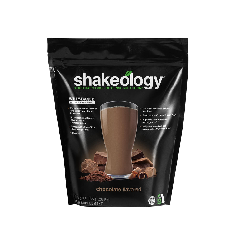 Shakeology chocolate powder close-up highlighting premium whey blend for a satisfying shake