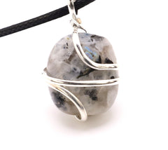 Shelf and Stone Rainbow Moonstone pendant close-up with iridescent glow for new beginnings.