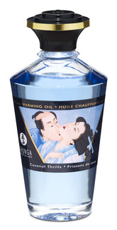 Shunga Warming Oil Coconut bottle close-up, highlighting coconut scent for mood-enhancing moments