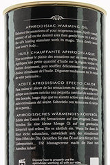 Shunga warming oil applied on skin to heighten sensation