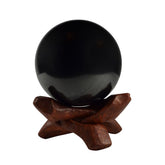 Shungite World authentic 50mm sphere with stand for grounding and decor.