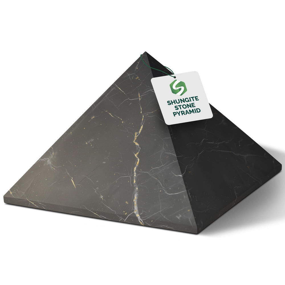 Shungite World authentic pyramid 120mm on display for focus and energy balance.