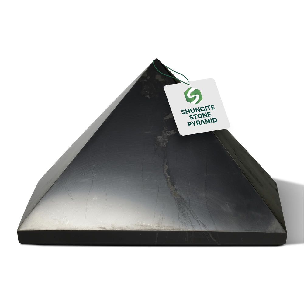 Shungite World polished 80mm pyramid close-up highlighting glossy surface for focus and decor.