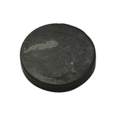 Shungite World authentic 40mm sticker on a device surface showing grounding energy.