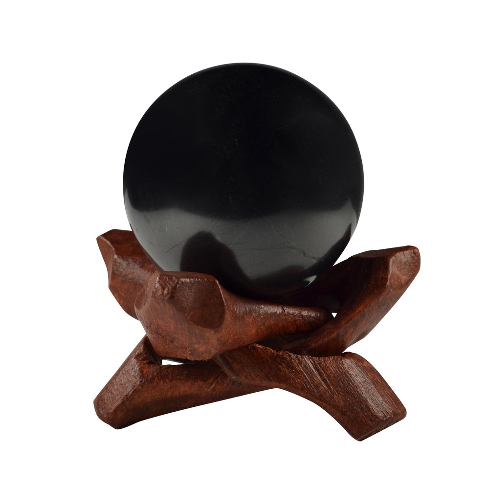 Shungite World sphere 40mm with stand on desk for grounding energy.