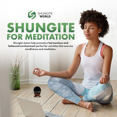 Shungite World sphere on workspace for energy balance around devices.
