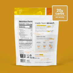 Skratch Labs Hydration Powder pineapple being poured into water for quick hydration.