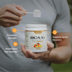 Snap Supplements BCAA powder being poured into a shaker.