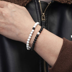 Softones 6mm lava stone bracelet on the wrist, unisex style.