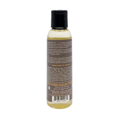 Soothing Touch bath oil being poured for a luxurious moisturizing bath routine.