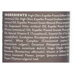 Soothing Touch Muscle Comfort massage oil in hand for soothing aromatherapy and relief.