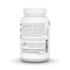 Person holding Magtein capsules for on-the-go daily focus and mood support