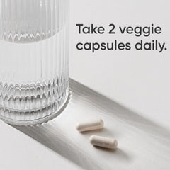 Sports Research Magnesium Glycinate serving scoop beside bottle for daily intake