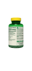 Spring Valley calcium bottle beside a glass of water for easy daily intake