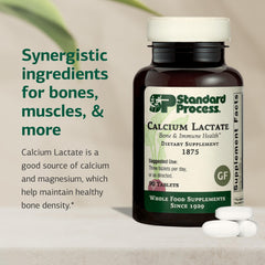 Close-up of Standard Process Calcium Lactate tablets showing non-dairy vegan formulation for bone health