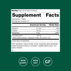 Close-up of Standard Process E-Manganese tablet highlighting manganese and vitamin E.