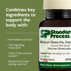Glass bottle of Standard Process Wheat Germ Oil Fortified on a kitchen counter for daily routine.