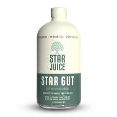 Star Juice bottle on wood table promoting gut health after meals