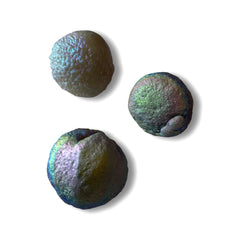 Starborn Rainbow Chalcedony Unicorn Poop under light reveals butterfly-wing iridescence