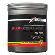 Strength Genesis grass-fed whey protein powder in chocolate-banana flavor, ideal for post-workout shakes.
