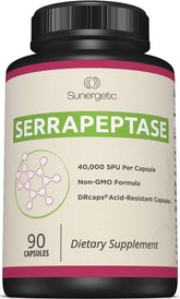 Sunergetic Serrapeptase bottle on table, may support overall wellness with enzyme benefits.