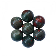 Sunshcat African Bloodstone ball closeup shows natural color and polish for mindful aesthetics.