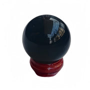 Sunshcat black obsidian sphere on wooden stand for feng shui decor
