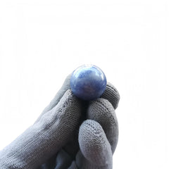 Close-up of Sunshcat blue aventurine ball showing natural color variation.
