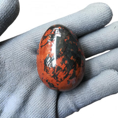 Sunshcat crystal egg closeup highlights natural grain and serene aesthetic.