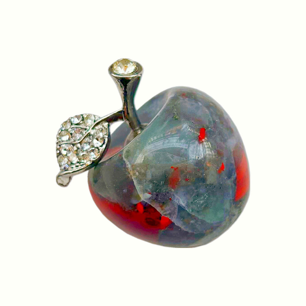 Sunshcat Purple Cats Eye Apple Crystal Statue on desk promoting serene energy.