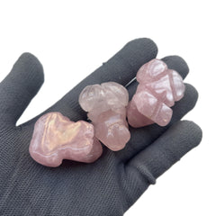Close-up of Sunshcat rose quartz frog facial detail for meditation calm.