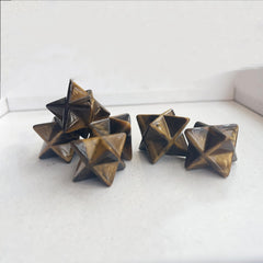 Sunshcat Tiger's Eye Merkaba crystal closeup, vivid color vibrance supports aura cleansing and inspiration.