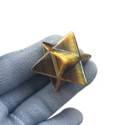 Sunshcat Tiger's Eye Merkaba hexagonal star crystal, front view, aids meditation and positive energy.