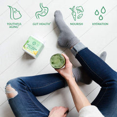 Sunwarrior Beauty Greens Drink scoop ready to mix with water.