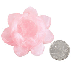SUNYIK candle holder in rose quartz complements warm lighting and serene space.