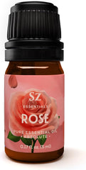 Sz Essentials Rose Absolute oil bottle being poured to evoke a calming spa atmosphere.